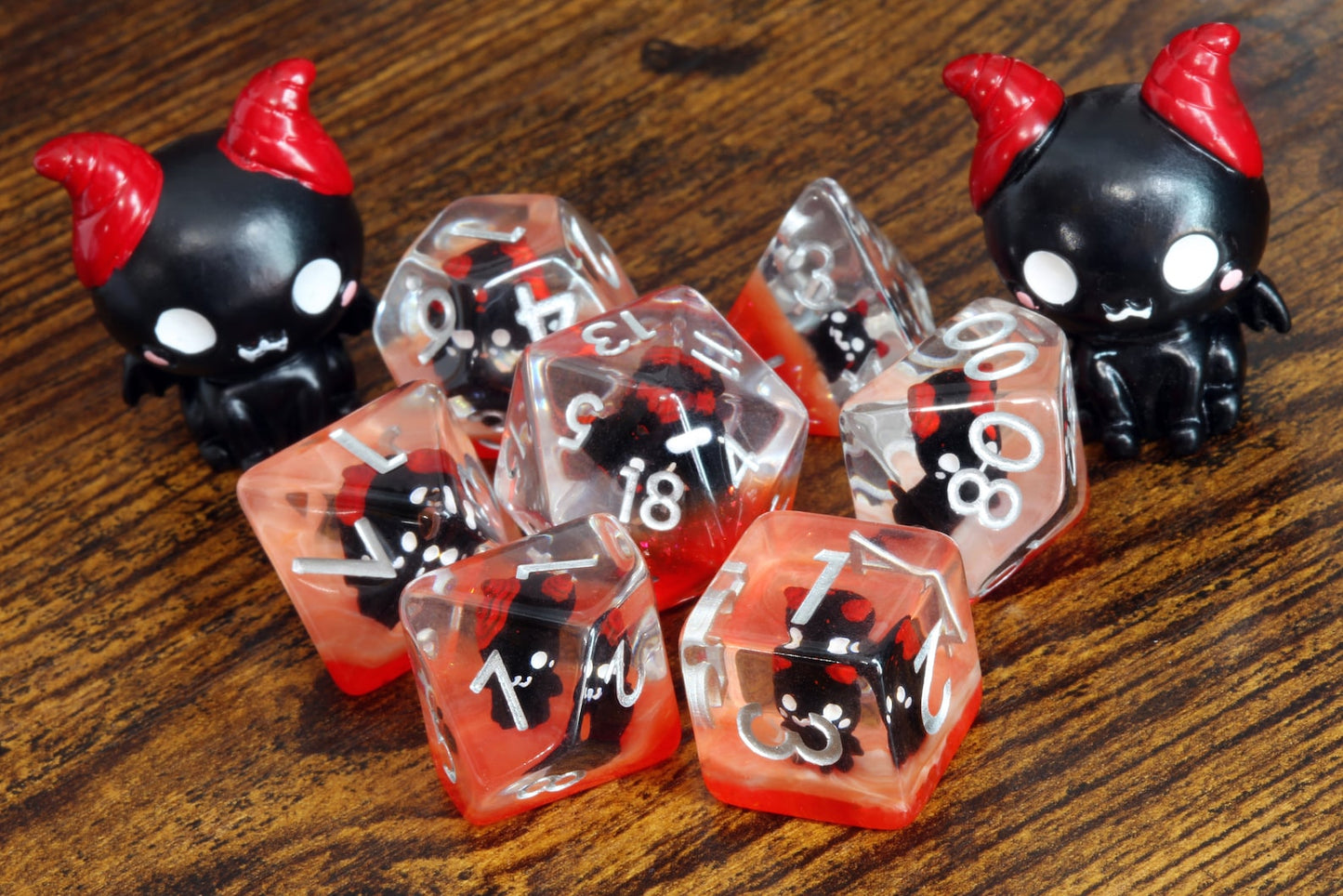 Demonic Cat dice set - Dice set with winged cats on an orange layer - The Wizard's Vault