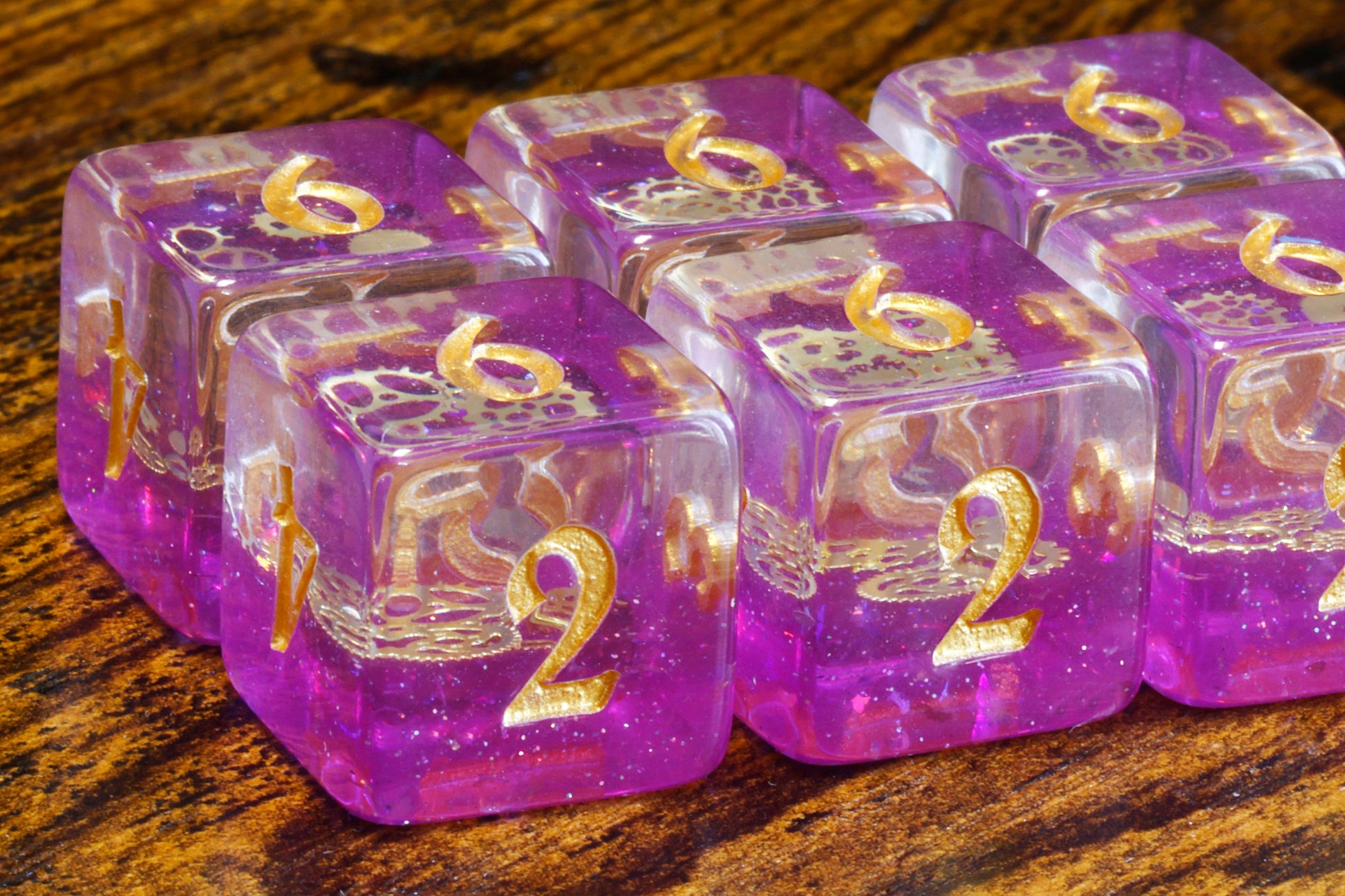 Arcane Sprockets D6 Dice, Purple glittery layer with small golden gear - The Wizard's Vault