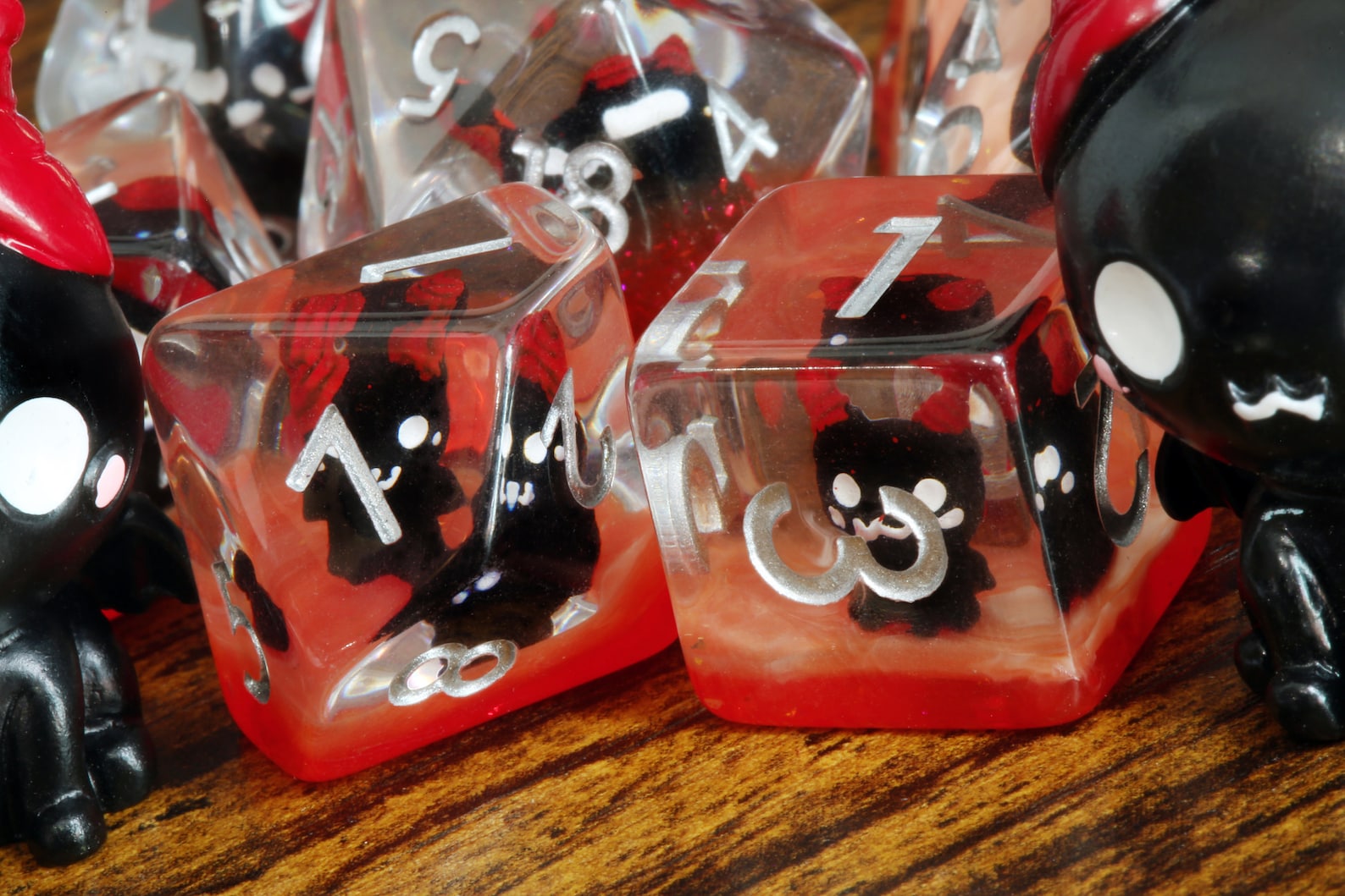 Demonic Cat dice set - Dice set with winged cats on an orange layer - The Wizard's Vault