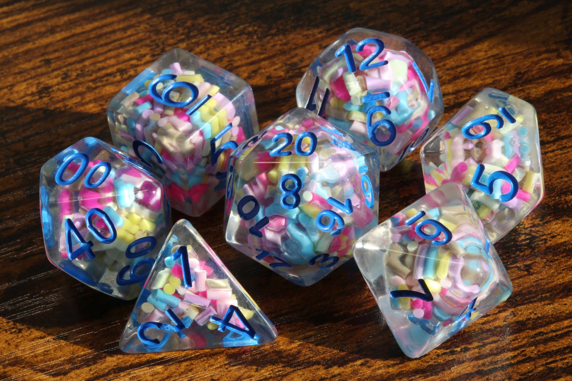 Funfetti cake dice set -  Sprinkle core DND Dice, Colorful sprinkles in a clear resin & blue font, Perfect Dungeon Master Birthday Gift - The Wizard's Vault