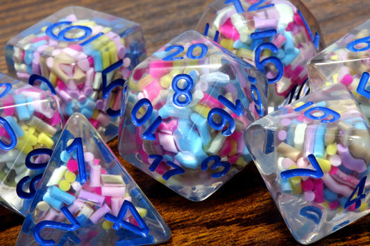 Funfetti cake dice set -  Sprinkle core DND Dice, Colorful sprinkles in a clear resin & blue font, Perfect Dungeon Master Birthday Gift - The Wizard's Vault